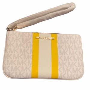 Michael Kors white wristlet with yellow stripe